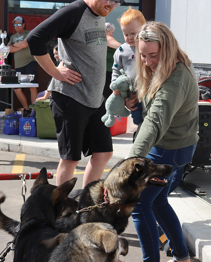 People enjoyed petting the sled dogs at the Borderland Co-op Food Store on August 23.